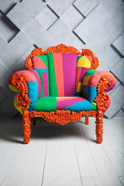 Concept of luxury and success with multi colored velvet armchair - Photo, Image