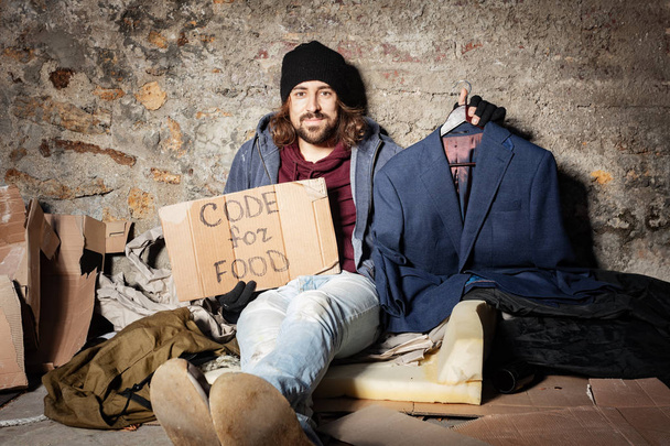 Jobless man with cardboard Code for food sign - Fotografie, Obrázek