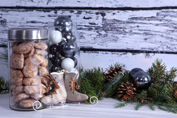 Christmas vintage composition with jar of homemade cookies and decorations on wooden background - Foto, immagini
