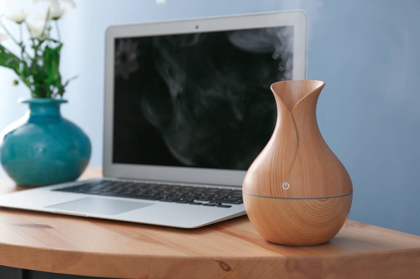 Aroma oil diffuser on table in room - 写真・画像