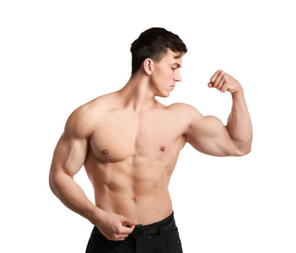 Muscular bodybuilder on white background - Foto, afbeelding