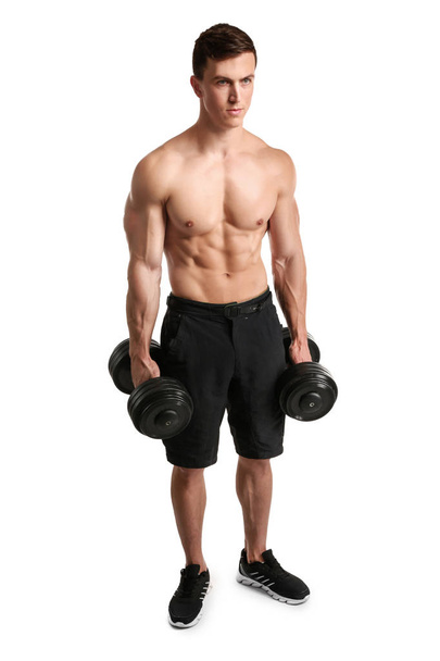 Muscular bodybuilder with dumbbells on white background - Foto, Imagem