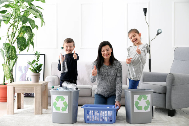 Family sorting garbage at home. Concept of recycling - Φωτογραφία, εικόνα