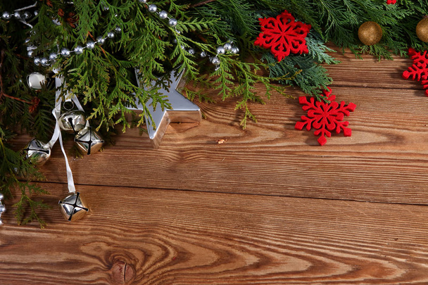 Christmas composition on brown wooden background - Foto, Imagen