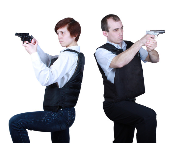 Профессиональные мужчина и женщина с оружием
 - Фото, изображение