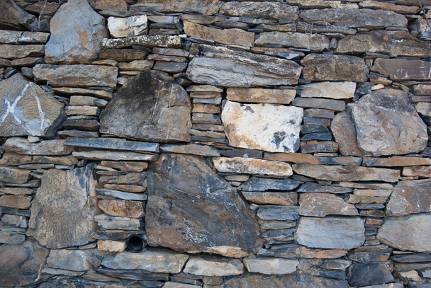 Fondo de pared de piedra. Italia muro de piedra sin cemento. edificios históricos
  - Foto, imagen