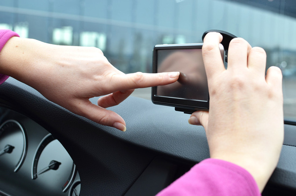 Car driver operating a navigation system - Fotó, kép