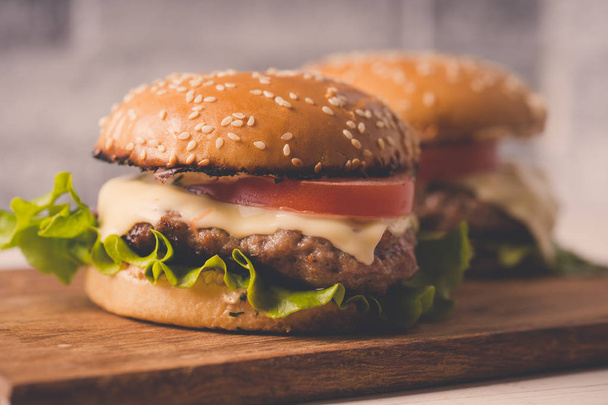 Hamburgers or sandwiches is the popular fast food for brunch or lunch. - Фото, зображення