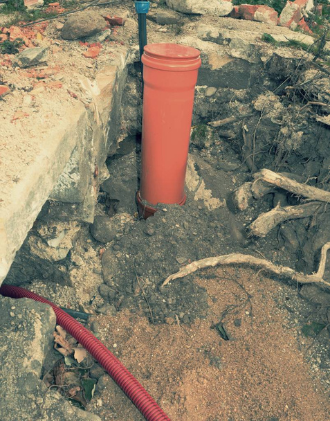 Safety tube with cables. Reconstruction site with trench - Photo, Image