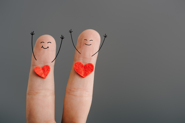 cropped view of happy couple of fingers with hearts isolated on grey, valentines day concept - Foto, Imagem