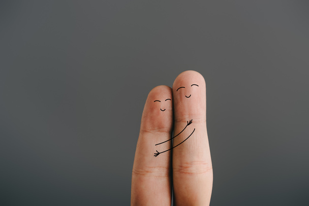 cropped view of happy couple of fingers embracing isolated on grey - Foto, Bild