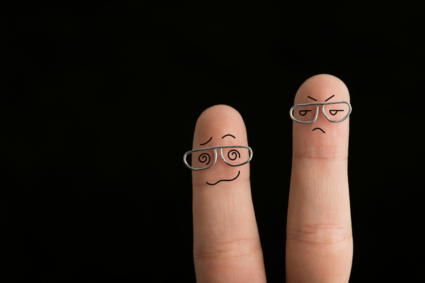 cropped view of frustrated fingers in glasses isolated on black - Photo, Image