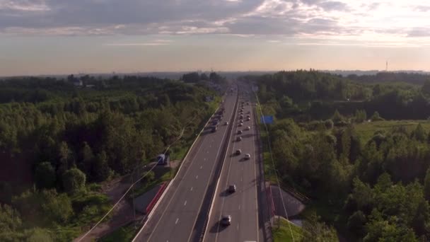 Traffic on the highway, evening trail. Trucks on the road. - Materiaali, video