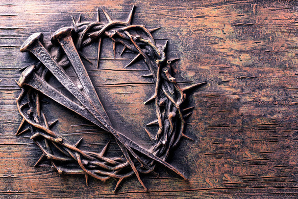 Crown of thorns and nails engraved on stone - Photo, Image