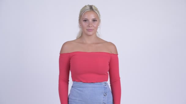 Young stressed blonde woman giving thumbs down - Imágenes, Vídeo