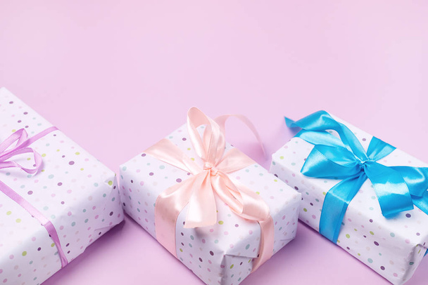 Variety of Gift Boxes on Pastel Pink Background Shopping Sales or Holidays Concept Holiday Background Top View Horizontal Copy Space - Foto, Imagem