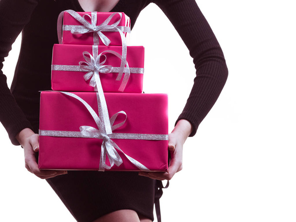 Girl carrying many pink gift boxes - Foto, afbeelding