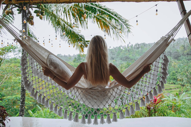Healthy sleep in the open air at hammock. Sexy woman relaxing - Foto, imagen