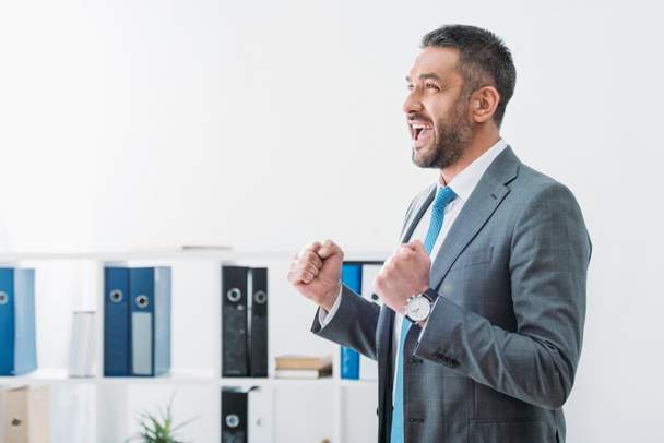businessman standing and showing yes gesture in office - Photo, Image