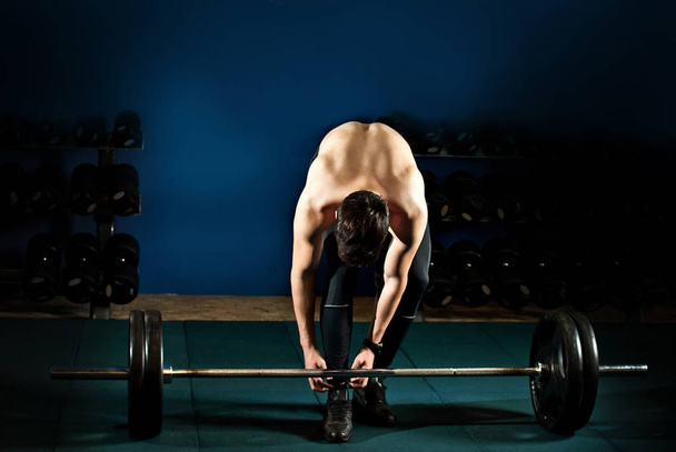 an athlete trains in the gym - Фото, зображення
