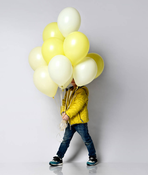 Stylish little boy holding air balloon isolated on white - Foto, Imagem