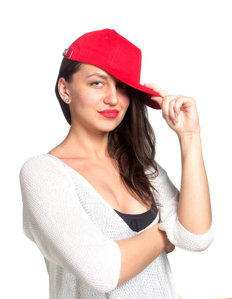 Attractive young woman wearing a red baseball cap - Фото, зображення