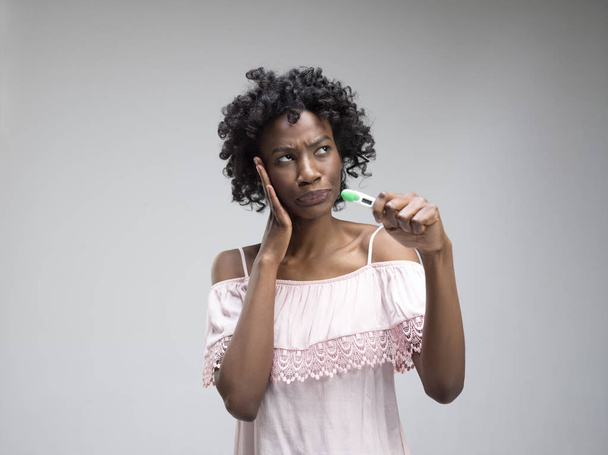 young woman looking on pregnancy test - Fotó, kép