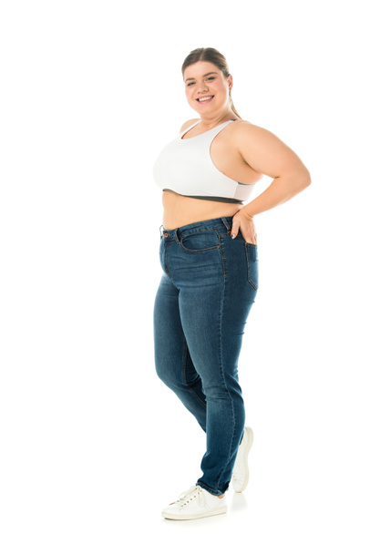 happy smiling overweight woman in jeans posing with hand in pocket isolated on white, body positivity concept - Foto, Imagen