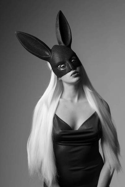 The charming girl with long straight white hair and black rabbit mask on her head - Photo, image