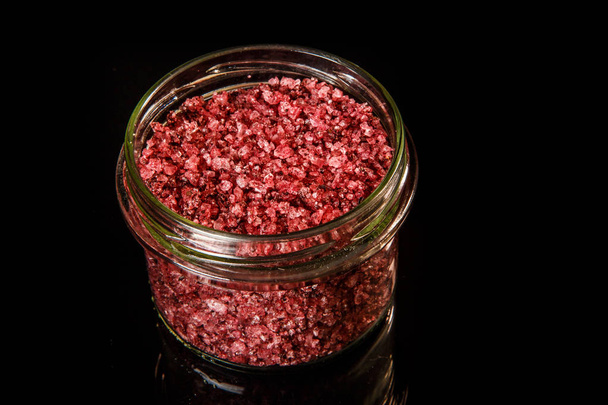 top view closeup small glass jar with big red organic sea salt - Photo, Image