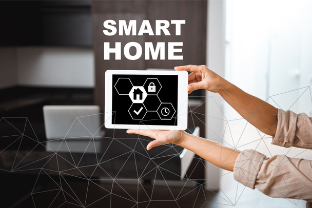 selective focus of digital tablet with smart home icons illustration in female hands - Fotoğraf, Görsel
