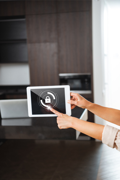 selective focus of digital tablet with smart home security lock illustration in female hands - Photo, Image