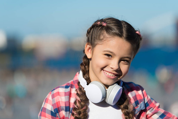 For enjoying sound of music. Adorable music fan with wireless headset on neck. Little child using technology for listening music. Small girl with stereo headphones. Music education - Fotoğraf, Görsel