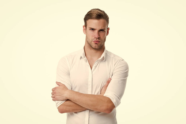 Young and confident. Man well groomed white elegant shirt isolated white background. Macho confident ready work office. Guy office worker handsome holds hands crossed. Office worker appearance - Foto, afbeelding