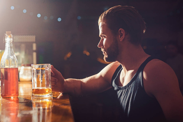 Refreshing beer to drink right now. Alcohol addiction and bad habit. Man drinker in pub. Handsome man drink beer at bar counter. Alcohol addict with beer mug. Addicting to alcoholic drink - Photo, Image