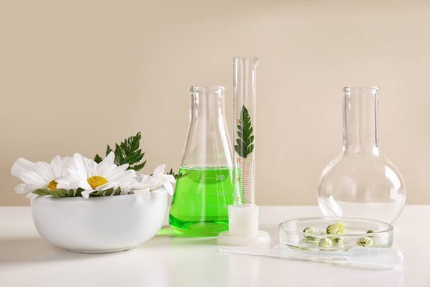 Ingredients and laboratory glassware on table. Dermatology research - Fotó, kép