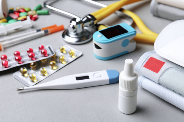 Set of medical objects on grey table - Foto, imagen