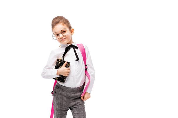 Child with schoolbag. Girl with pink school bag isolated on white. - 写真・画像