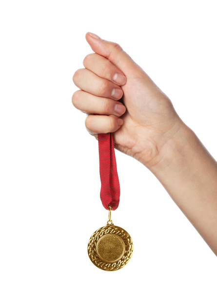 Woman holding gold medal with space for design on white background, closeup. Victory concept - Φωτογραφία, εικόνα