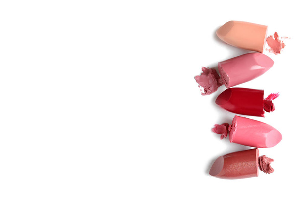 Different lipstick swatches on white background, top view - Foto, imagen