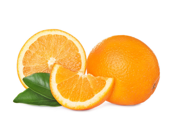 Fresh ripe oranges with leaves isolated on white - Photo, image