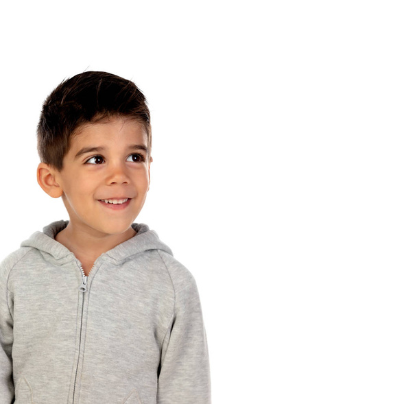 Счастливый ребенок в серой толстовке на белом фоне
 - Фото, изображение