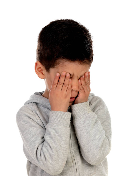 Sad child crying isolated on a white background - Fotó, kép
