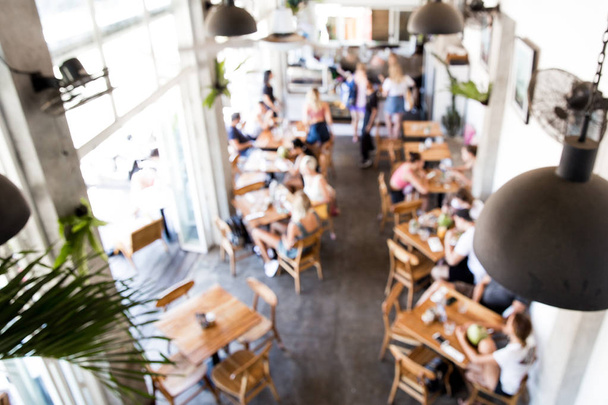 Blurred background of people in the cafe in loft style. - 写真・画像