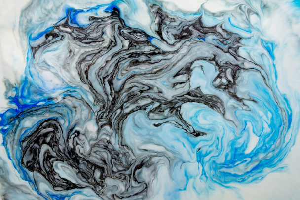 Abstract beautiful blue marble pattern with black color.The Eastern style of Ebru painting on water with acrylic paints swirls.A stylish mix of colors,natural luxury.  - Foto, afbeelding