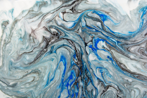 Abstract beautiful blue marble pattern with black color.The Eastern style of Ebru painting on water with acrylic paints swirls.A stylish mix of colors,natural luxury.  - Photo, Image
