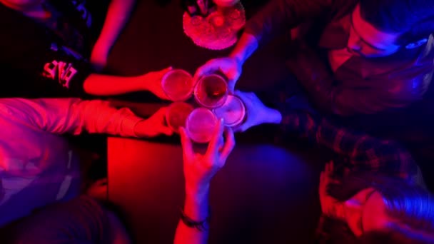 Bar with neon lighting. People spending time together. Cheers - Footage, Video