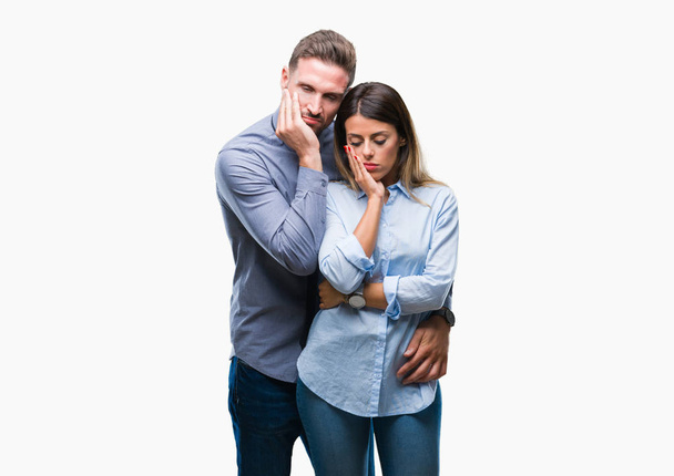 Young workers business couple over isolated background thinking looking tired and bored with depression problems with crossed arms. - Foto, Imagem