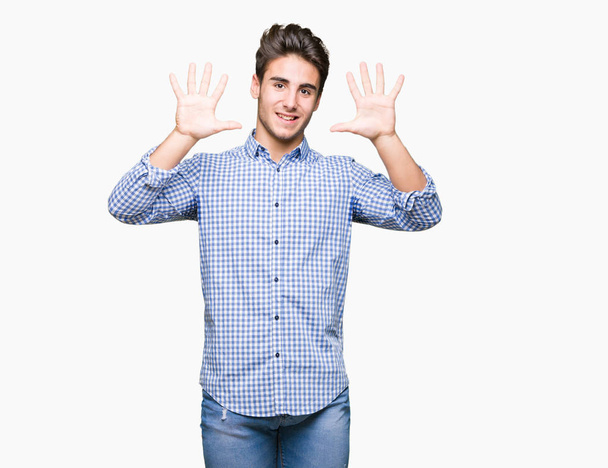 Young handsome business man over isolated background showing and pointing up with fingers number ten while smiling confident and happy. - Foto, Imagem