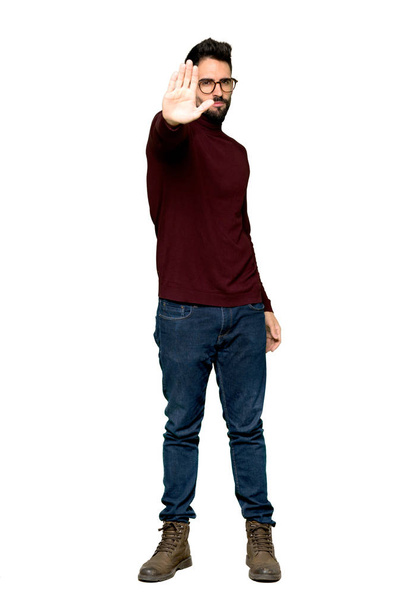 Full-length shot of Handsome man with glasses making stop gesture denying a situation that thinks wrong on isolated white background - Valokuva, kuva